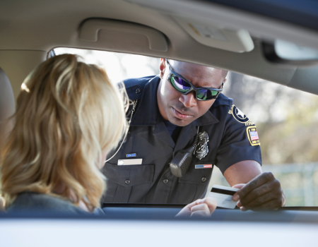 Were you recently pulled over in Arizona? Did the officer tell you why? Law enforcement officials don’t need to clearly state the rationale behind pulling you over, leaving you wondering about the legality of your stop. Let’s discuss when a cop has to tell you why they pulled you over in Arizona, your rights, and what you should do when being pulled over. 
Does a Cop Have to Tell You Why They Pulled You Over in Arizona? 
No, a cop does not have to tell you why they pulled you over, but law enforcement officials cannot pull you over without probable cause. If you take your violation or ticket to court, the cop will be required to share the rationale behind pulling you over. Being stopped unlawfully does happen, which is why many Arizona citizens record police interactions when they can.
Most officers will explain why you are being pulled over to facilitate a smooth process. However, some police officers will ask rhetorical questions. For example, a common question is, “Do you know how fast you were going?” It’s important to respond carefully, but honestly in these situations. 
What Are Your Rights When Being Pulled Over? 
You have rights when being pulled over in Arizona. First, you have the right to remain silent. You don’t need to answer probing questions, such as where you are traveling to or from. Next, you have the right to refuse a search. Officers can bypass this right if there is clear evidence that you have committed a crime, such as open alcohol in the passenger seat. 
You also have the right to a lawyer. If you are detained, you do not need to answer any questions without a lawyer present. Be sure you express your wishes upfront. In addition, you do have the right to remain in your vehicle. If the officer does ask you to step out, it’s best to comply to avoid escalating the situation. 
What Should You Do When Being Pulled Over in Arizona?
When you get pulled over by Arizona law enforcement, remain calm and stop your car when it is safe to do so. Be sure you aren’t obstructing traffic and turn on your hazards. Next, roll down your window and keep your hands where the police officer can see them, such as on the steering wheel. Your passengers should abide by the same rules. 
Police officers are trained to respond within a moment’s notice, which is why it’s important to avoid any sudden movements. Provide the officer with any requested documents, such as your driver’s license, registration, and proof of insurance. Sometimes, the officer will explain why you are being pulled over. It doesn’t hurt to ask, but don’t be confrontational. 
Write down the officer’s badge number if you can and gather witness contact information if you believe you are being unlawfully pulled over. Then, contact a qualified attorney that can walk you through the next steps and legal proceedings. 
Summary
Does a Cop Have to Tell You Why They Pulled You Over in Arizona?